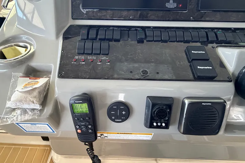 Slide: The Image of Control panel of a 2014 Sea Ray 540 Sundancer with navigation and communication equipment. - 31