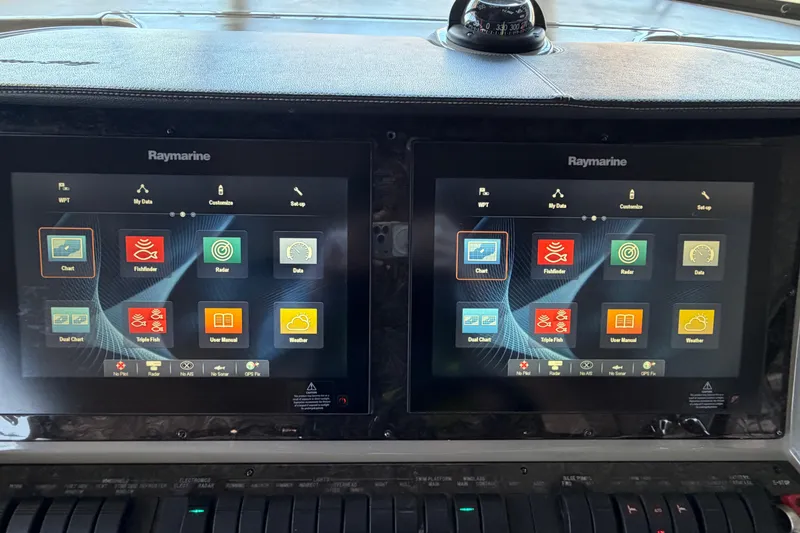 Slide: The Image of Raymarine navigation screens on 2014 Sea Ray 540 Sundancer yacht dashboard. - 33