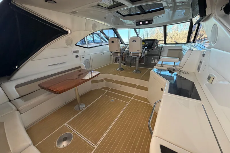 Slide: The Image of Interior of 2014 Sea Ray 540 Sundancer yacht with seating and helm station. - 35