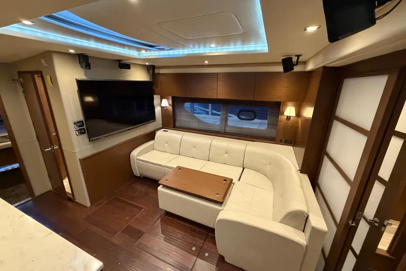 Slide: The Image of Luxurious interior of 2014 Sea Ray 540 Sundancer yacht with white leather seating and modern decor. - 44