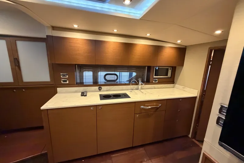 Slide: The Image of Luxurious kitchen interior of 2014 Sea Ray 540 Sundancer yacht with modern amenities. - 45