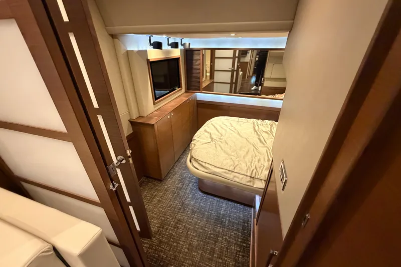 Slide: The Image of Luxurious cabin interior of 2014 Sea Ray 540 Sundancer yacht with bed and TV. - 47
