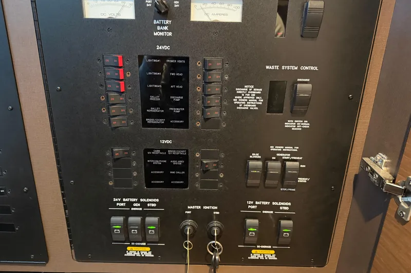 Slide: The Image of Control panel of a 2014 Sea Ray 540 Sundancer yacht, featuring battery and waste system controls. - 64