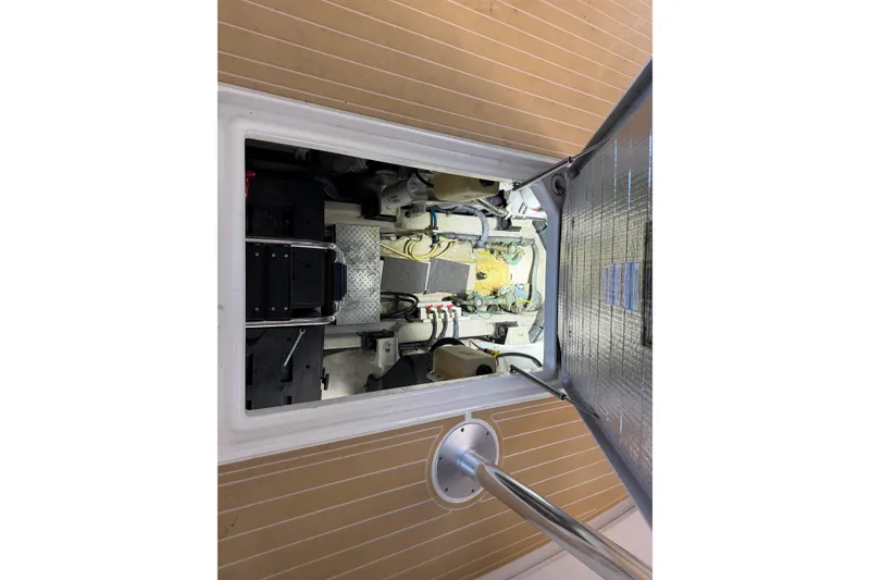 Slide: The Image of Engine compartment of 2014 Sea Ray 540 Sundancer yacht, showcasing mechanical components. - 66