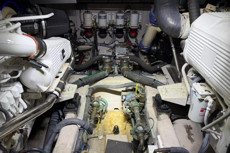 Slide: The Image of Engine room of 2014 Sea Ray 540 Sundancer yacht, showcasing mechanical components and systems. - 68