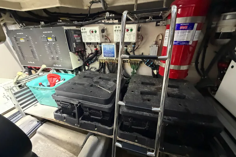 Slide: The Image of Engine room of 2014 Sea Ray 540 Sundancer with control panels and equipment. - 69