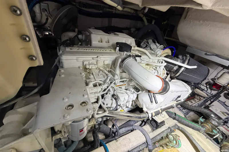 Slide: The Image of Engine compartment of a 2014 Sea Ray 540 Sundancer yacht, showcasing detailed machinery. - 70