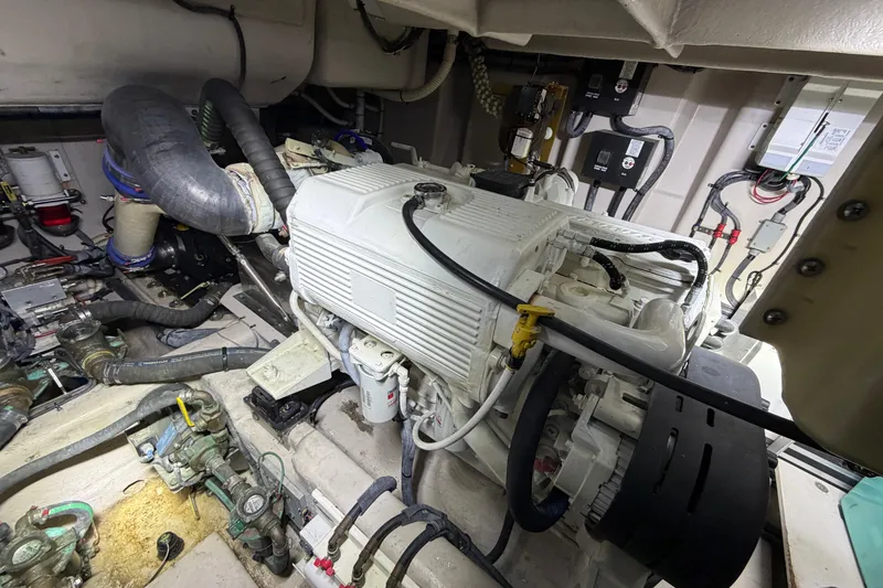 Slide: The Image of Engine room of 2014 Sea Ray 540 Sundancer with visible components and wiring. - 78