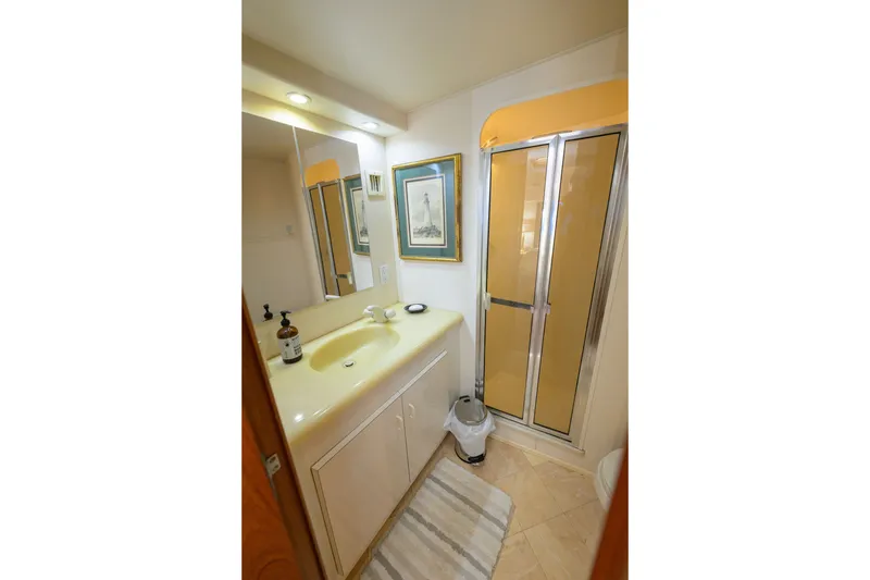 Slide: The Image of Bathroom interior of 1997 Viking 58 Enclosed Bridge yacht with shower and sink. - 17
