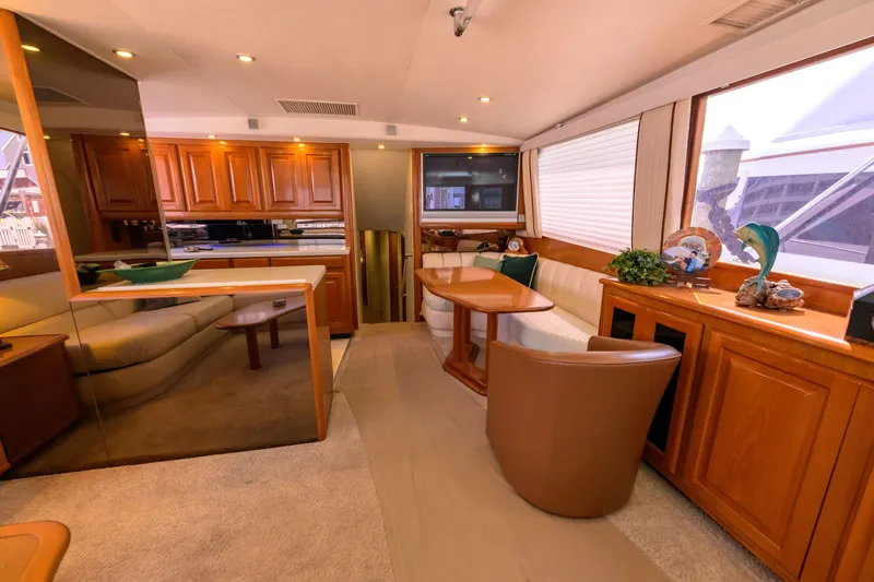 Slide: The Image of Luxurious interior of 1997 Viking 58 Enclosed Bridge yacht with elegant wood finishes. - 3