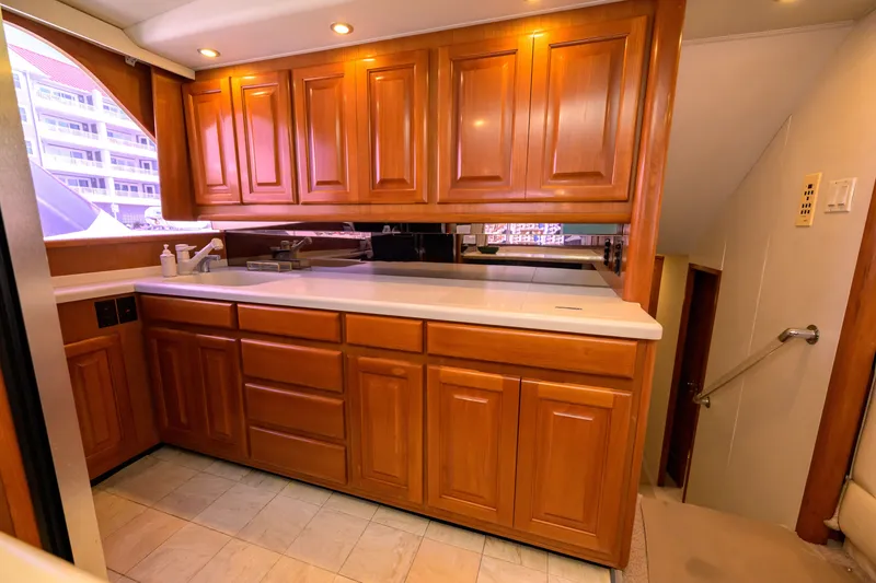 Slide: The Image of Luxurious wooden cabinetry in 1997 Viking 58 Enclosed Bridge yacht interior. - 8