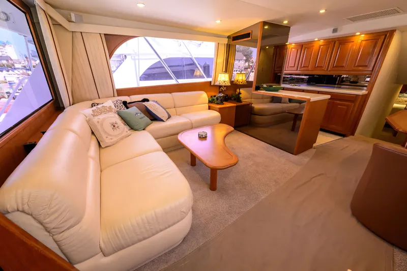 Slide: The Image of Luxurious interior of a 1997 Viking 58 Enclosed Bridge yacht with plush seating and elegant decor. - 2