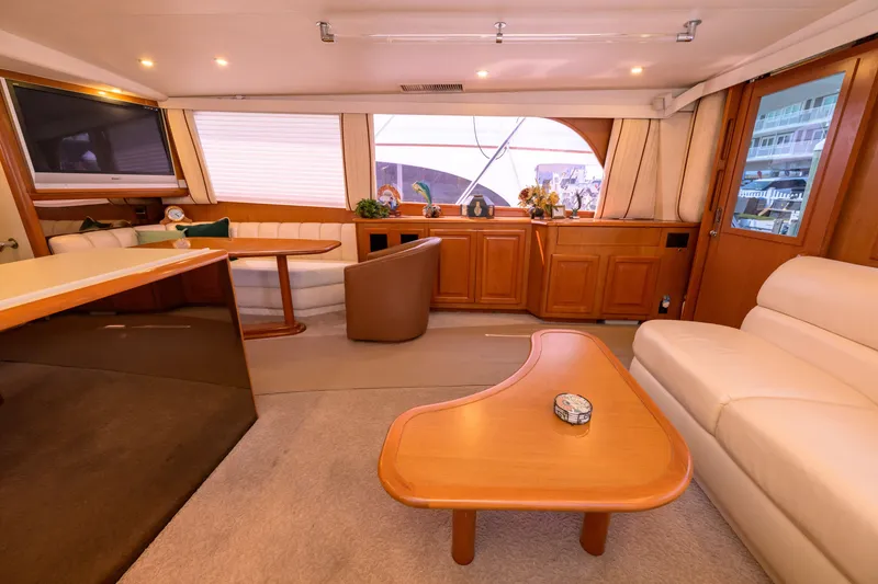 Slide: The Image of Luxurious interior of 1997 Viking 58 Enclosed Bridge yacht with elegant furnishings. - 5