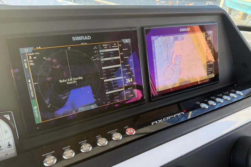 Slide: The Image of Simrad navigation system on 2021 Axopar 28 Cabin boat dashboard. - 12