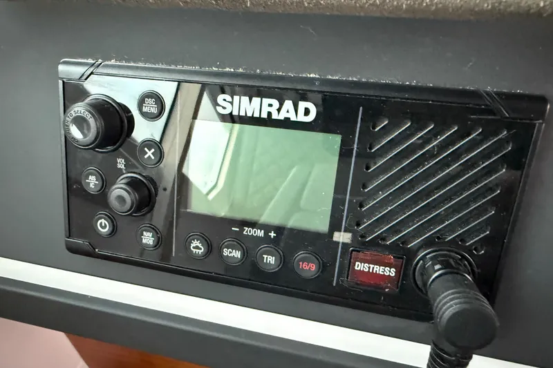 Slide: The Image of Simrad marine radio on 2021 Axopar 28 Cabin boat dashboard. - 15