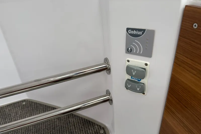 Slide: The Image of Control panel and handrails on 2021 Axopar 28 Cabin boat interior. - 37