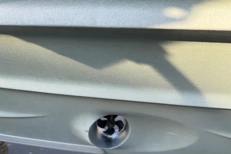 Slide: The Image of Close-up of 2021 Axopar 28 Cabin hull with visible thruster detail. - 43