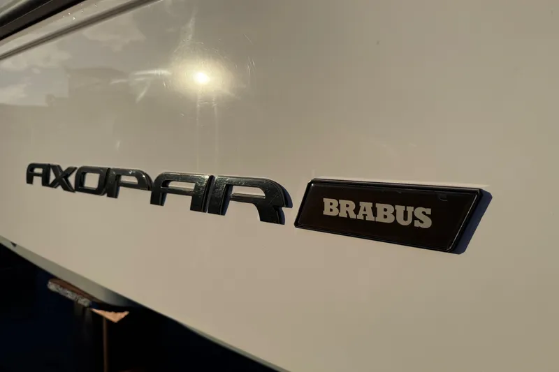Slide: The Image of 2021 Axopar 28 Cabin boat with Brabus branding in sunlight. - 44
