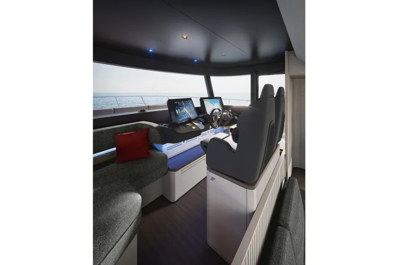 Slide: The Image of Luxurious interior of 2026 Absolute Navetta 66 yacht with modern helm and seating. - 11