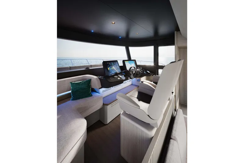 Slide: The Image of Luxurious interior of 2026 Absolute Navetta 66 yacht with modern helm and seating. - 12