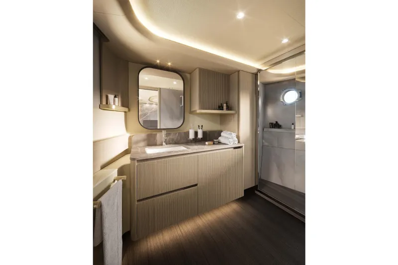 Slide: The Image of Luxurious bathroom interior of 2026 Absolute Navetta 66 yacht, featuring modern design and elegant lighting. - 17