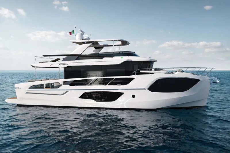 Slide: The Image of Luxury Absolute Navetta 66 yacht cruising on open sea, 2026 model. - 2