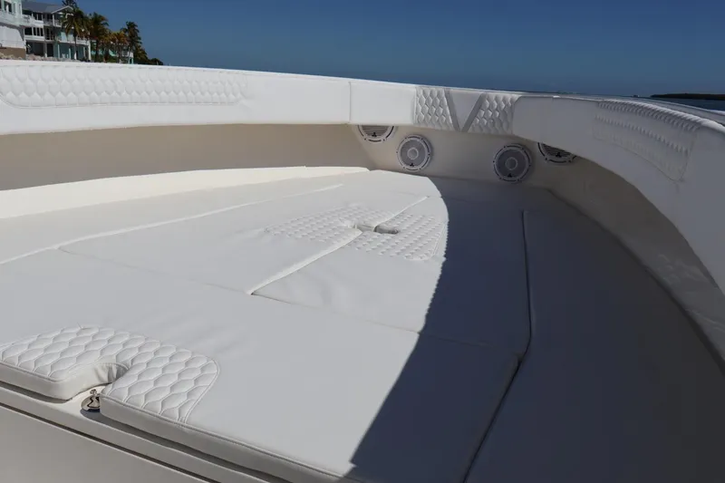 Slide: The Image of Luxurious seating area on a 2005 Venture 39 Open boat, featuring white cushioned upholstery. - 11