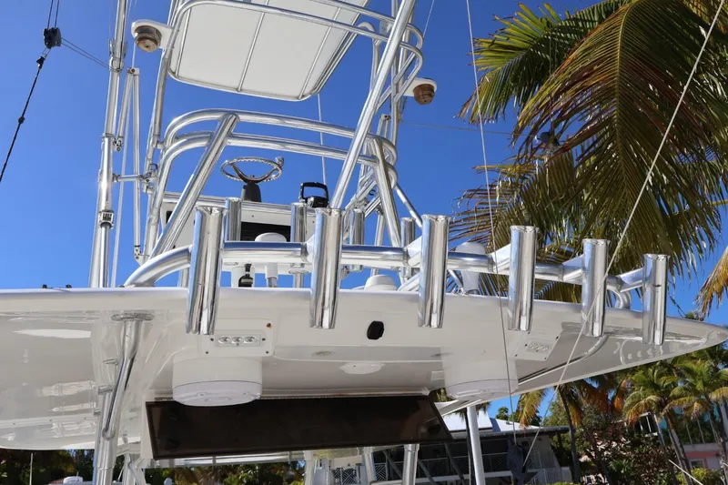 Slide: The Image of 2005 Venture 39 Open boat with polished metal structure and palm trees in the background. - 15