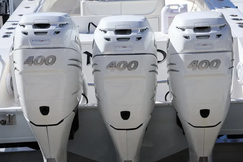 Slide: The Image of Triple 400 horsepower outboard engines on a 2005 Venture 39 Open boat. - 17