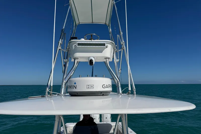 Slide: The Image of 2005 Venture 39 Open boat with Garmin equipment on open sea under clear blue sky. - 20