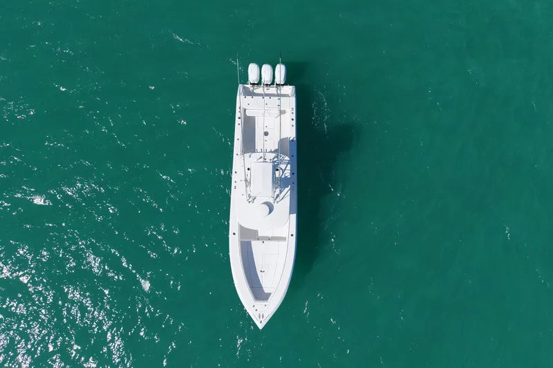 Slide: The Image of Aerial view of 2005 Venture 39 Open boat on turquoise water. - 3