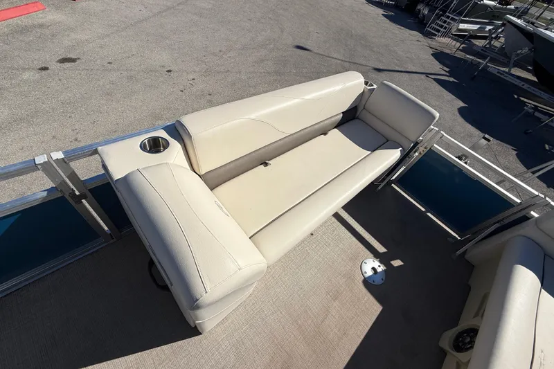 Slide: The Image of 2020 Avalon 2280 Venture Quad Lounger with beige seating and cup holder on deck. - 20