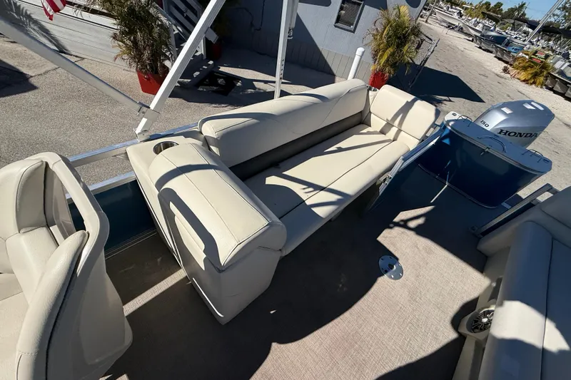 Slide: The Image of 2020 Avalon 2280 Venture Quad Lounger with beige seating and Honda outboard motor. - 22