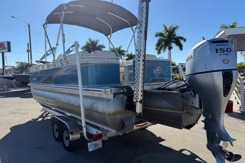 Slide: The Image of 2020 Avalon 2280 Venture Quad Lounger pontoon boat with Honda 150 VTEC engine. - 8