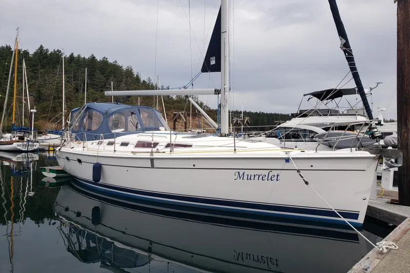 Slide: The Image of 2009 Hunter 38 sailboat named Murrelet docked in a marina. - 1