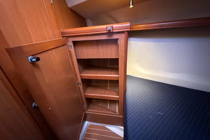 Slide: The Image of Wooden cabinet and bed in 2009 Hunter 38 yacht interior. - 12