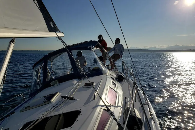 Slide: The Image of Sailing on a 2009 Hunter 38 yacht with people enjoying the ocean view. - 24