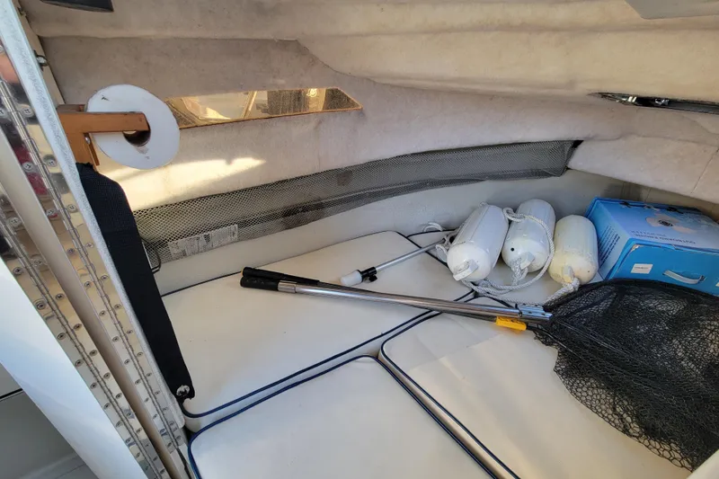 Slide: The Image of Interior of a 1998 Arima Sea Ranger 19 boat with fishing gear and equipment. - 20