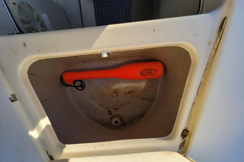 Slide: The Image of Compartment in 1998 Arima Sea Ranger 19 with orange safety equipment. - 27