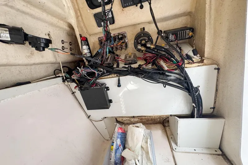 Slide: The Image of Interior wiring of a 2014 Everglades 230 Dual Console boat, showing electrical components. - 110
