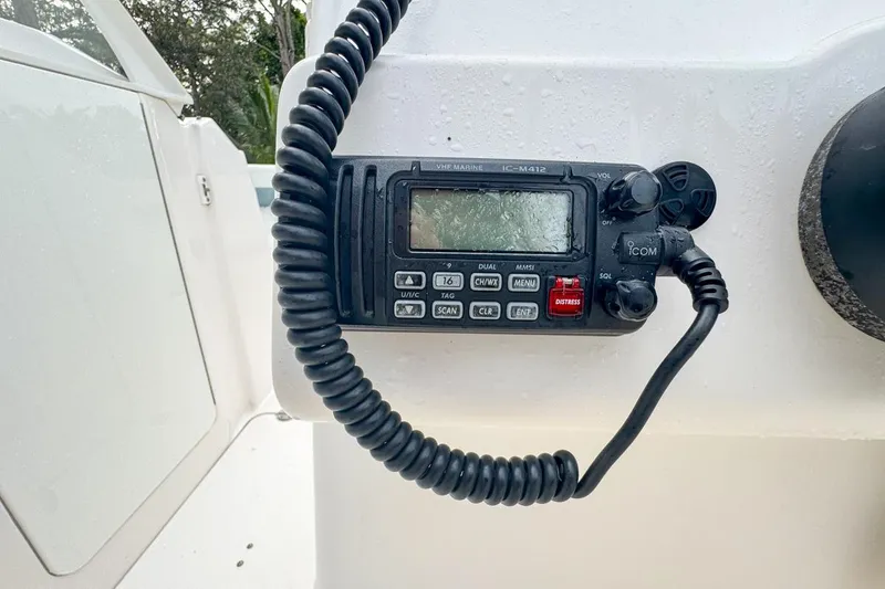 Slide: The Image of VHF marine radio on 2014 Everglades 230 Dual Console boat dashboard. - 44