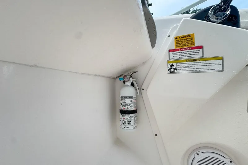 Slide: The Image of Fire extinguisher mounted on 2014 Everglades 230 Dual Console boat interior. - 45