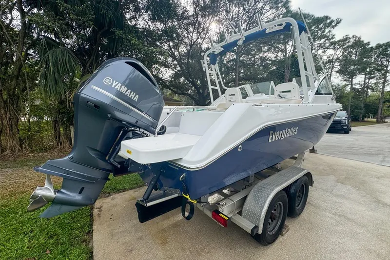Slide: The Image of 2014 Everglades 230 Dual Console boat with Yamaha engine on trailer. - 5