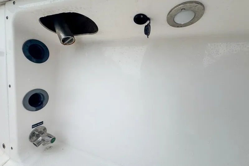 Slide: The Image of 2014 Everglades 230 Dual Console boat interior with fittings and fixtures. - 79