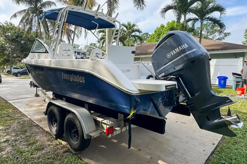 Slide: The Image of 2014 Everglades 230 Dual Console boat on trailer with Yamaha outboard motor. - 8
