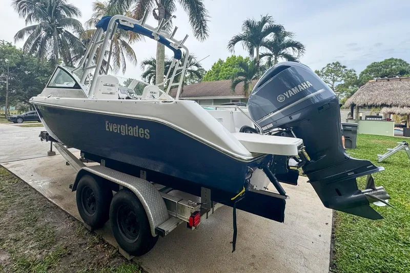 Slide: The Image of 2014 Everglades 230 Dual Console boat on trailer with Yamaha outboard motor. - 9
