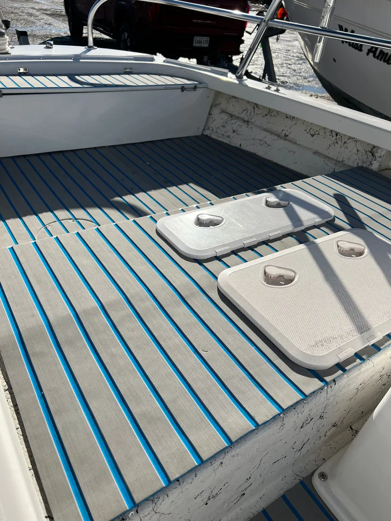 Slide: The Image of Interior of a 2021 C-Hawk 16 Tiller boat with blue stripes. - 10