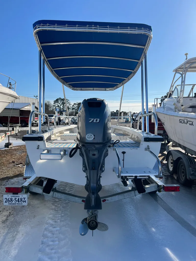 Slide: The Image of 2021 C-Hawk 16 Tiller boat with outboard motor and sun canopy. - 8