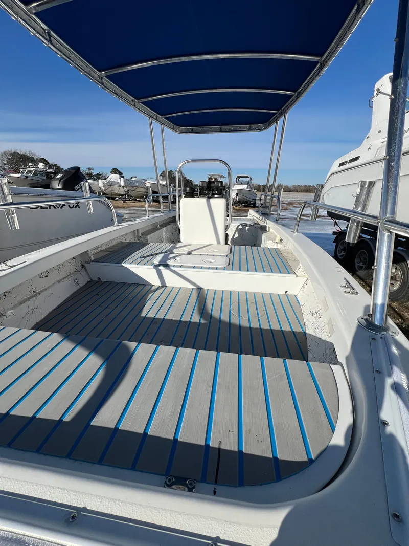Slide: The Image of 2021 C-Hawk 16 Tiller with blue canopy and gray flooring. - 9