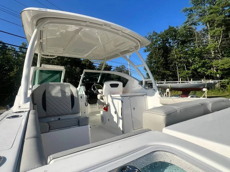 Slide: The Image of 2022 Pursuit DC 266 Dual Console boat with spacious seating and modern design. - 25